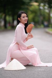 Pink Ao Dai Grace: Vietnamese Beauty with Elegant Girl and Traditional Conical Hat-9