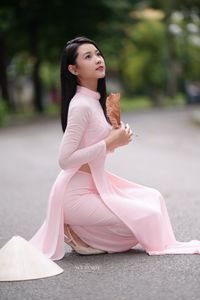 Pink Ao Dai Grace: Vietnamese Beauty with Elegant Girl and Traditional Conical Hat-4